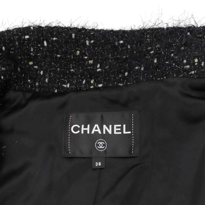 CHANEL 
COCO CC bouton Coco en laine pailletée 
manteau en tweed à motif Coco