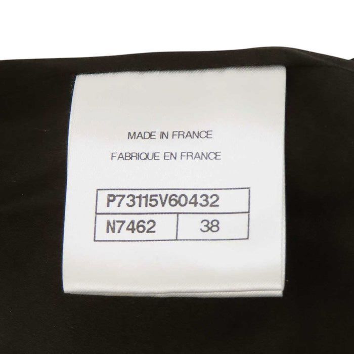 CHANEL 
COCO CC bouton Coco en laine pailletée 
manteau en tweed à motif Coco